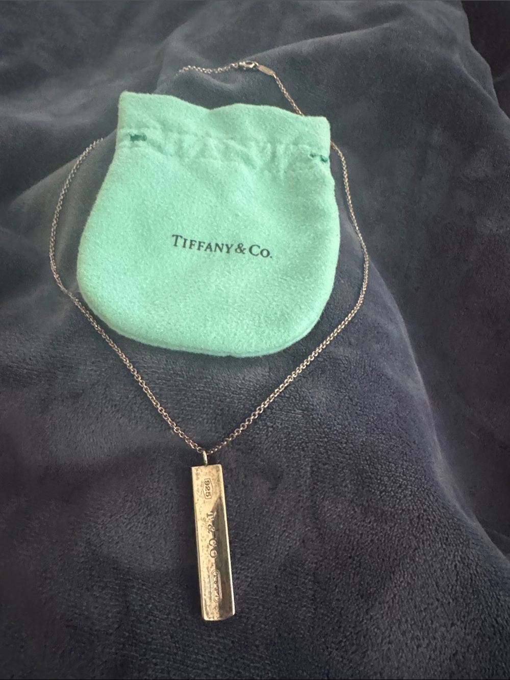 Necklace pendant on Tiffany pouch